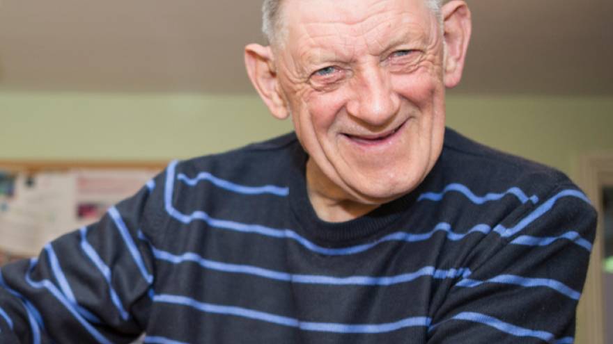Older man smiling at the camera