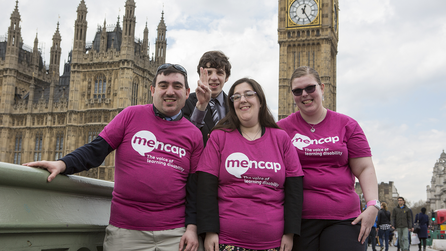 Group of people stood outside Houses of Parliament in London