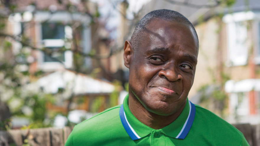 Man stood outside smiling