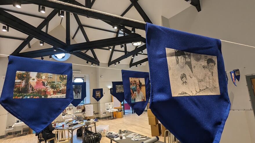 Picture bunting hanging down from the ceiling of Chepstow Mencap's base.
