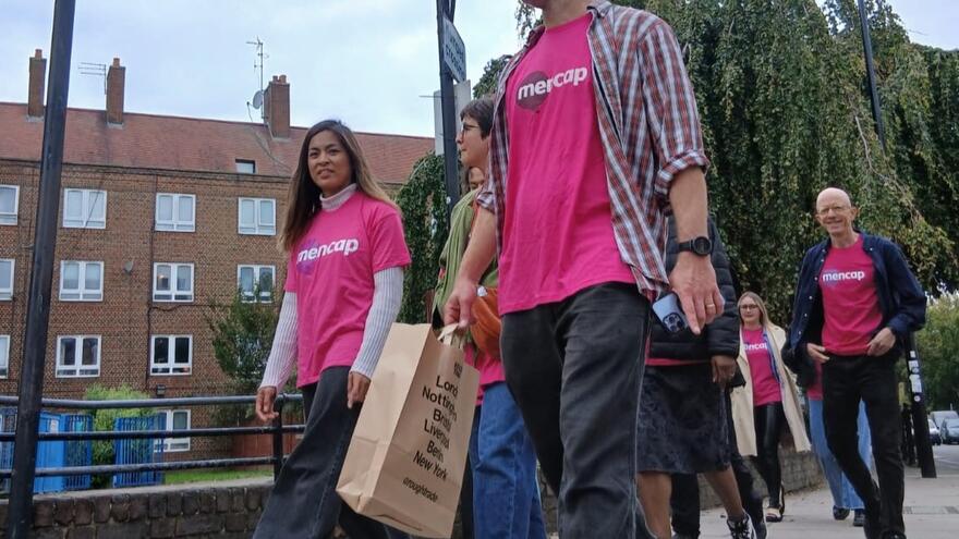 Group wearing Mencap t-shirts walking