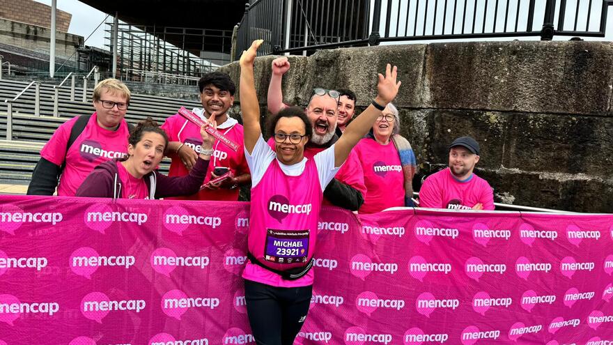 Michael Beynon with a group of people while running 