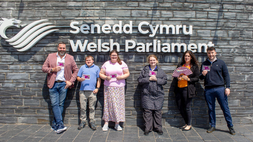 Wales Learning disability helpline volunteers and staff outside the Senedd